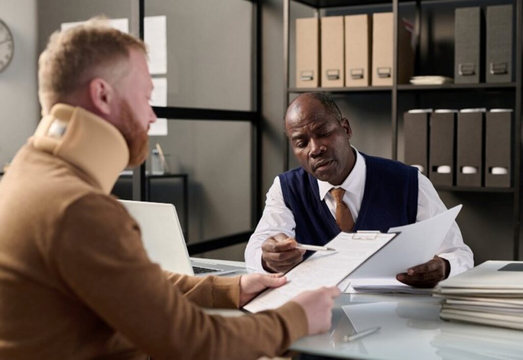 Lawyer going over legal terms with personal injury client