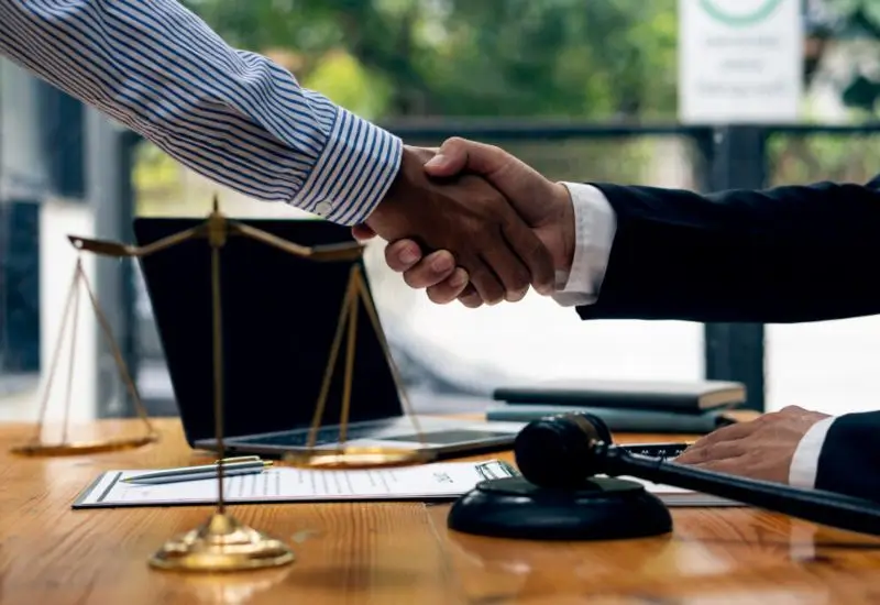 Lawyer and client shaking hands