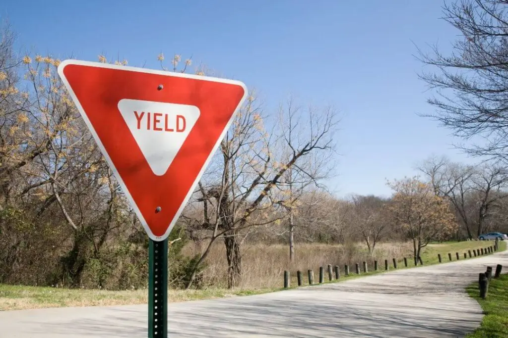 Yield sign on the side of the road