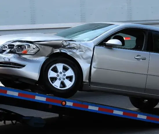 Car being towed away after car accident