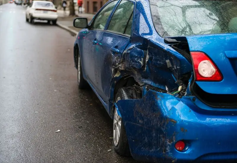 Hit and run involving a parked blue car