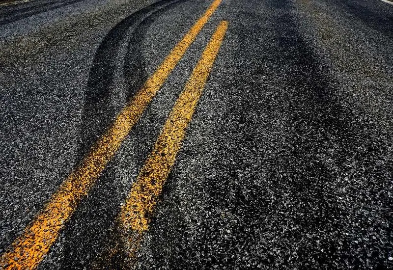 Off track tire marks on road