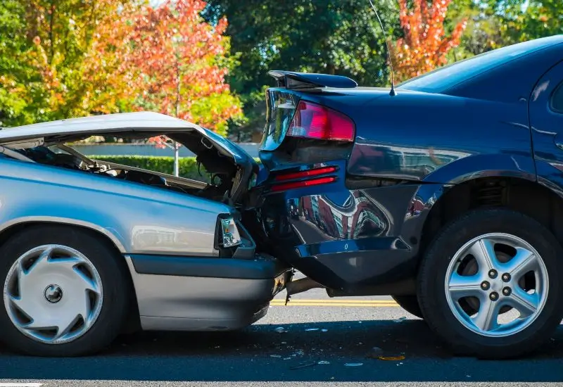 Black car getting rear-ended by a gray car 